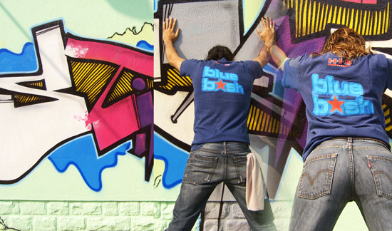 BlueBash t-shirt in front of a graffiti